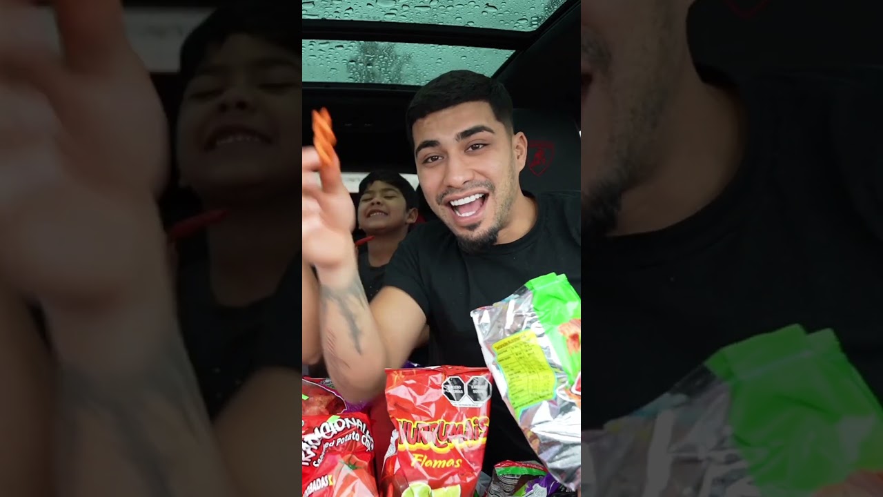 Son makes mom and dad try spicy chips with hot sauce #shorts